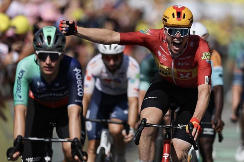 Uno-X Mobility team's Norwegian rider Soren Waerenskjold cycles to the finish line to win the 11th stage of the 113th edition of the Tour de France cycling race, 161,3 km between Vichy and Nevers in central France, on July 15, 2026. Anne-Christine POUJOULAT / AFP