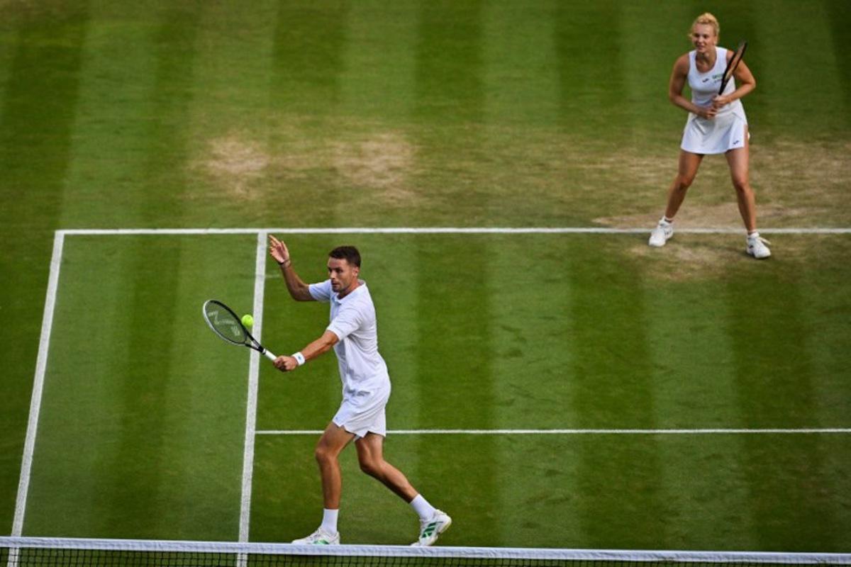 Netherlands' Sem Verbeek (L) and Czech Republic's Katerina Siniakova return the ball to Britain's Joe Salisbury and Brazil's Luisa Stefani during their mixed's doubles final tennis match on the eleventh day of the 2025 Wimbledon Championships at The All England Lawn Tennis and Croquet Club in Wimbledon, southwest London, on July 10, 2025. Glyn KIRK / AFP