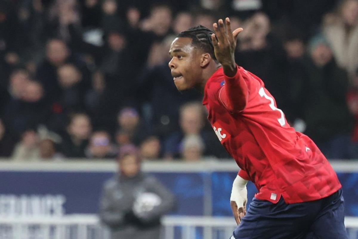 Lille's Belgian defender #03 Nathan Ngoy celebrates scoring his team's first goal during the French Cup round of 32 football match between Lille OSC and Olympique Lyonnais at the Stade Pierre-Mauroy in Villeneuve-d'Ascq, northern France on January 11, 2026. Francois LO PRESTI / AFP
