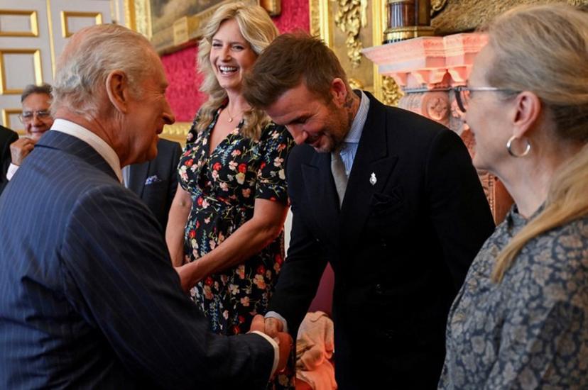 English former football player David Beckham (C) shakes hands with Britain's King Charles III (front L) during the King's Foundation Awards ceremony, on the 35th anniversary of The King's Foundation, at St James's Palace, in London, on June 12, 2025.   Chris J RATCLIFFE / POOL / AFP