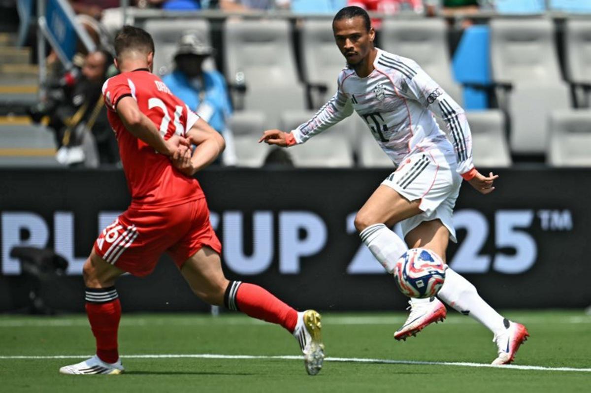 Bayern Munich's German midfielder #10 Leroy Sane (R) controls the ball in front of Benfica's Argentine forward #25 Gianluca Prestianni during the FIFA Club World Cup 2025 Group C football match between Portugal's Benfica and Germany's Bayern Munich at the Bank of America stadium in Charlotte on June 24, 2025. Paul ELLIS / AFP