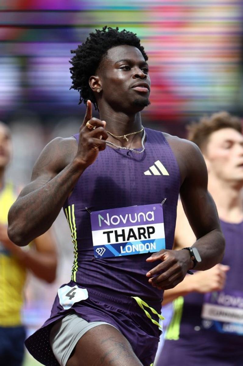 USA's Ja'Kobe Tharp celebrates after crossing the finish line to win the men's 110m hurdles event during the IAAF Diamond League athletics competition at the London stadium in London on July 18, 2026. Henry NICHOLLS / AFP