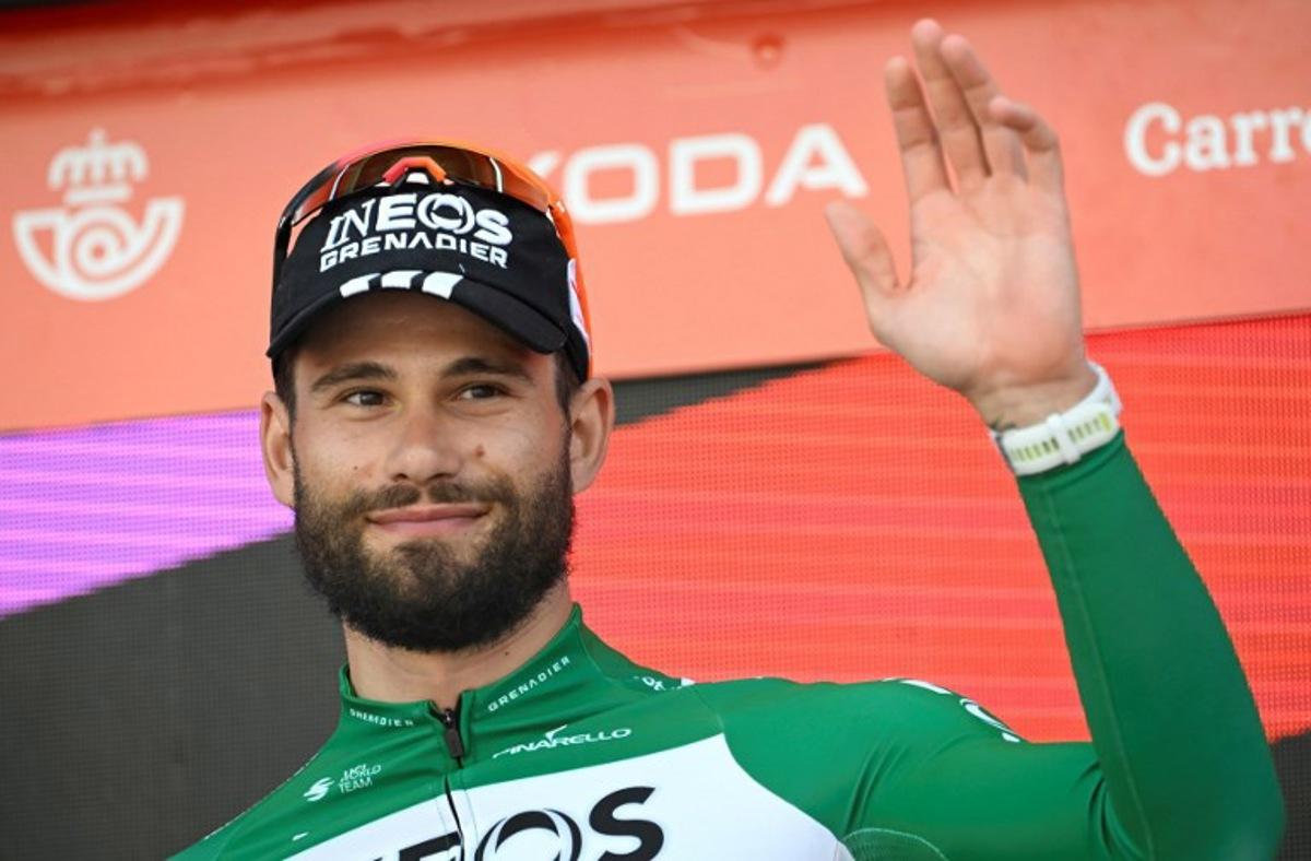 Stage winner team Ineos' Italian rider Filippo Ganna celebrates on the podium after the 18th stage of the Vuelta a Espana, a 26 km race against the clock between Valladolid and Valladolid, on September 11, 2025. Miguel RIOPA / AFP