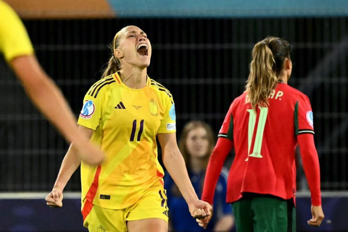 Belgium's defender #11 Janice Cayman celebrates after scoring the team's second goal during the UEFA Women's Euro 2025 Group B football match between Portugal and Belgium at the Stade de Tourbillon in Sion, on July 11, 2025. Fabrice COFFRINI / AFP