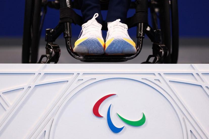 Gold medalist Poland's Kamil Otowski celebrates on the podium of the men's S1 100m backstroke swimming event during the Paris 2024 Paralympic Games at The Paris La Defense Arena in Nanterre, west of Paris on August 29, 2024. Franck FIFE / AFP