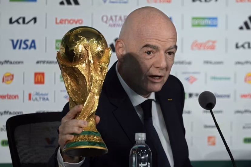Gianni Infantino holds the World Cup trophy during a press conference on the eve of the opening match of the 2026 World Cup football tournament at Mexico city stadium in Mexico City on June 10, 2026. Alfredo ESTRELLA / AFP