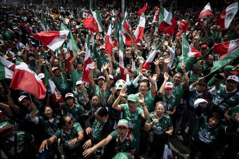 People take part in a Guinness World Record attempt for the world's largest Mexican Wave in Mexico City on June 6, 2026. Carl de Souza / AFP