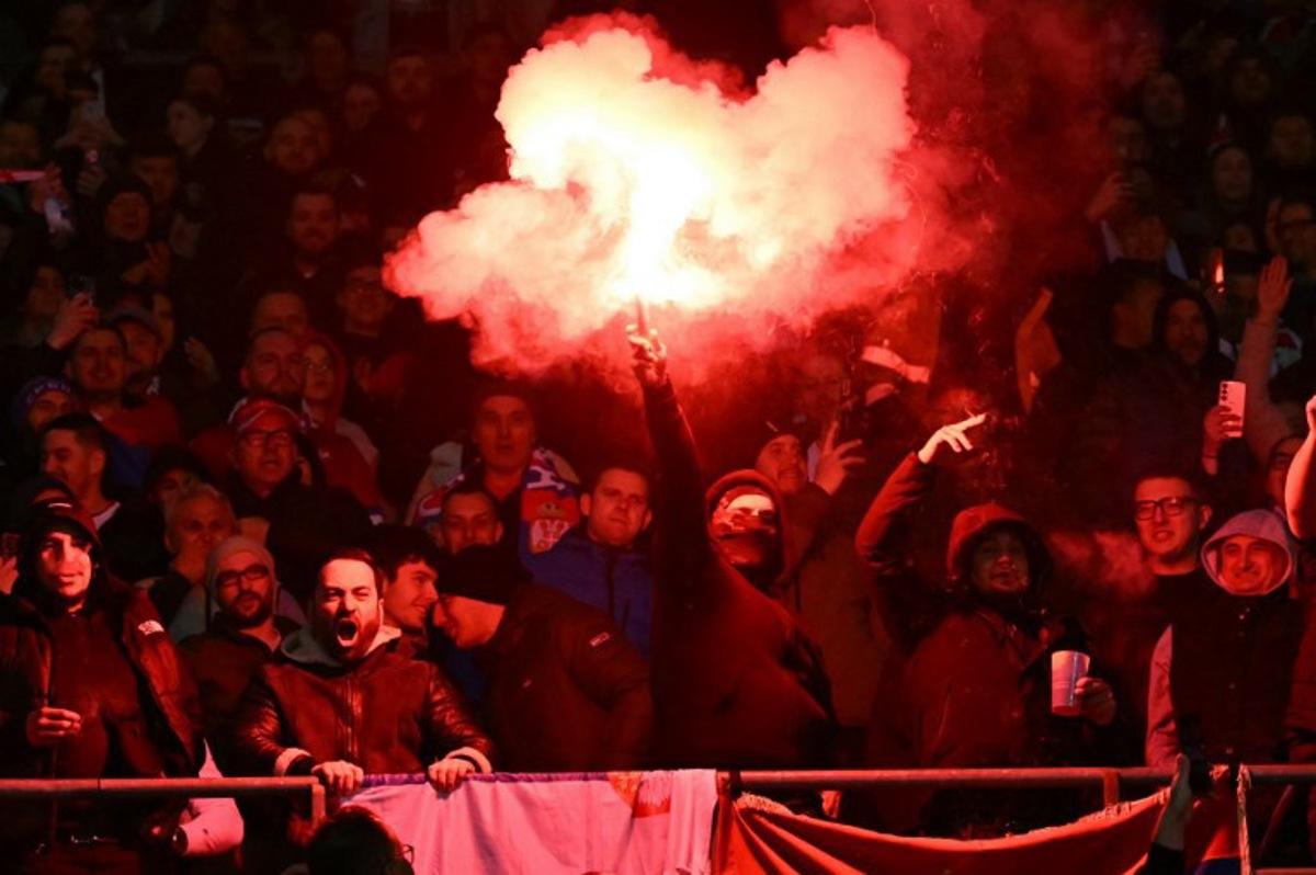 Serbian fans light flares during the UEFA Nations League play-off, first-leg football match Austria v Serbia at the Ernst Happel Stadium in Vienna on March 20, 2025. Joe Klamar / AFP