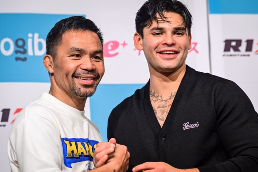 Philippine boxing legend Manny Pacquiao (L) poses with American boxer Ryan Garcia following Pacquiao's official weigh-in at a hotel in Tokyo on July 27, 2024 ahead of his July 28 three-round exhibition boxing match against Japanese mixed martial artist Rukiya Anpo. Yuichi YAMAZAKI / AFP