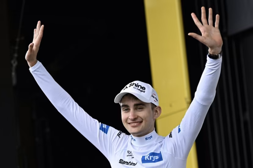 Decathlon CMA CGM Team's French rider Paul Seixas celebrates on the podium with the best young rider's white jersey after the 14th stage of the 113th edition of the Tour de France cycling race, 155,3 km between Mulhouse and Le Markstein in the Vosges mountains, on July 18, 2026. Loic VENANCE / AFP