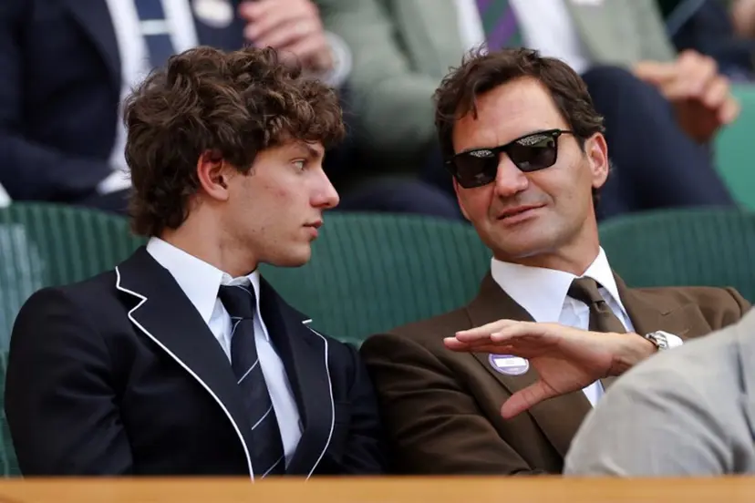Italian driver Kimi Antonelli (L) listents to Swiss former tennis player Roger Federer at the Centre Court's Royal Box on the eighth day of the 2026 Wimbledon Championships at The All England Lawn Tennis and Croquet Club in Wimbledon, southwest London, on July 6, 2026. Adrian Dennis / AFP