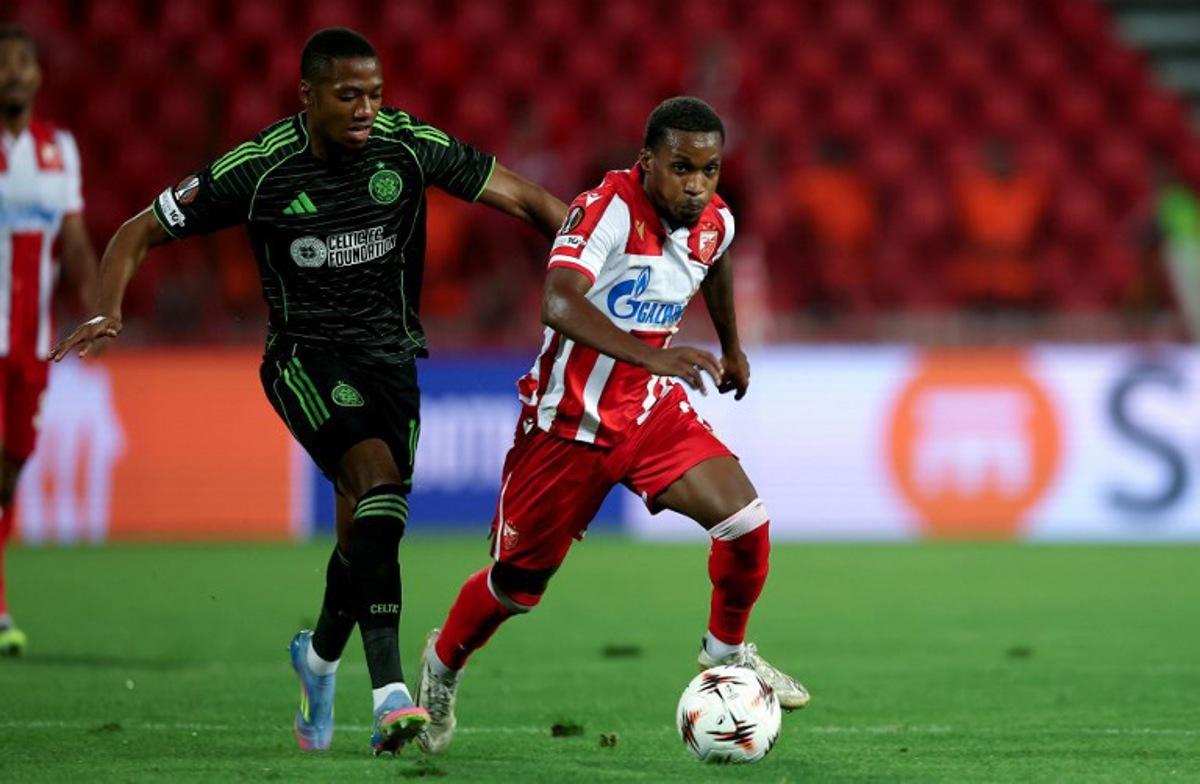Crvena Zvezda's #7 Joao Felicio Mendes (R) vies with Celtic's #10 Michel-Ange Balikwisha (L) during the UEFA Europa League football match between Crvena Zvezda (Red Star Belgrade) and Celtic (Glasgow) at the "Rajko Mitic" stadium in Belgrade on September 24, 2025. Predrag MILOSAVLJEVIC / AFP