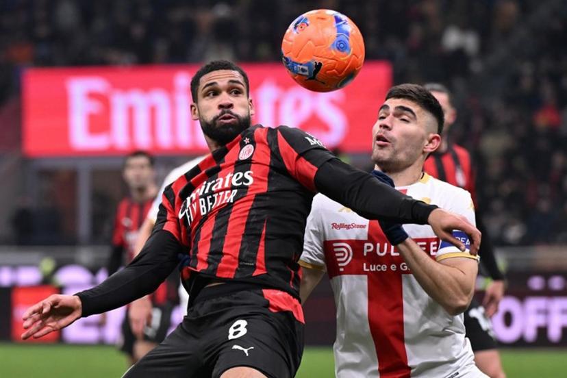 AC Milan's English midfielder #08 Ruben Loftus-Cheek (L) fights for the ball with Genoa's Mexican defender #22 Johan Vazquez during the Italian Serie A football match between AC Milan and Genoa at San Siro stadium in Milan, northern Italy, on January 8, 2025. Stefano Rellandini / AFP