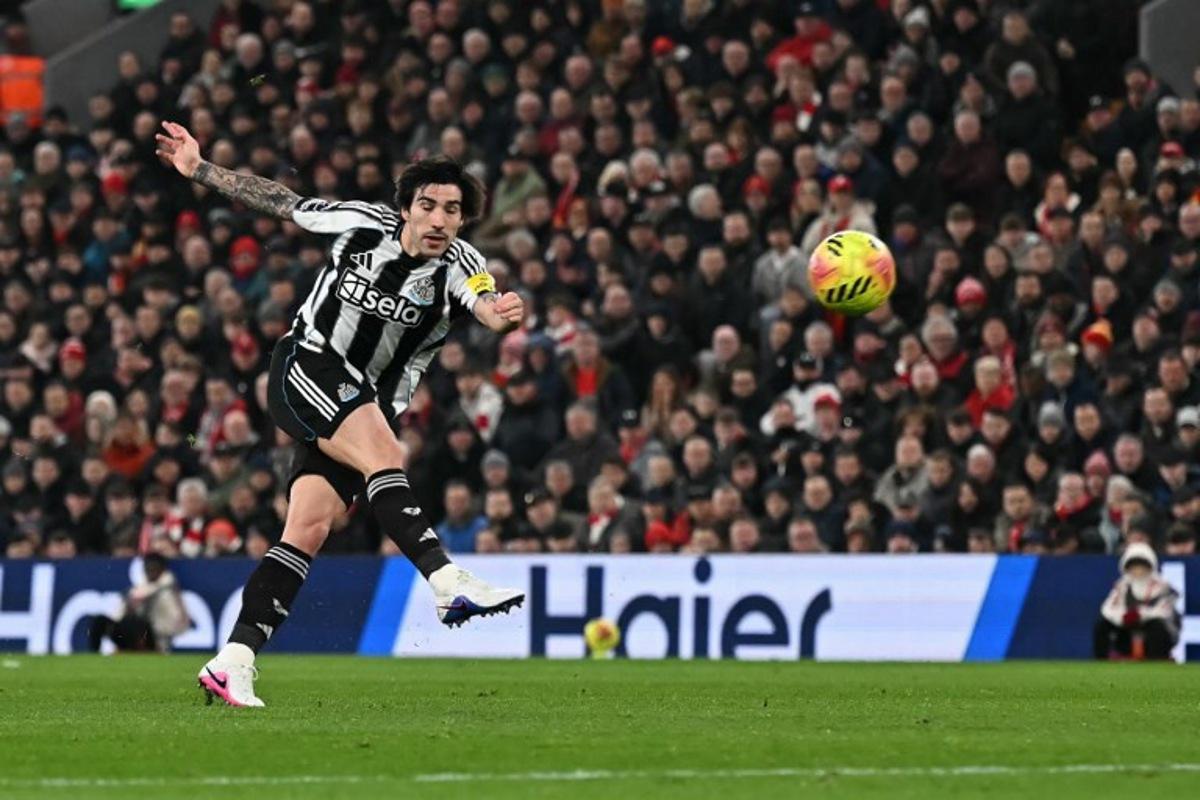 Newcastle United's Italian midfielder #08 Sandro Tonali shoots but fails to score during the English Premier League football match between Liverpool and Newcastle United at Anfield in Liverpool, north west England on January 31, 2026. Paul ELLIS / AFP