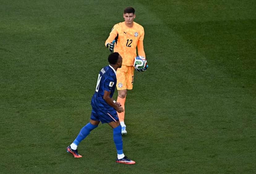 France's forward #10 Kylian Mbappe celebrates next to Paraguay's goalkeeper #12 Orlando Gill after winning the 2026 World Cup round of 16 football match between Paraguay and France at the Philadelphia Stadium in Philadelphia on July 4, 2026. Jewel SAMAD / AFP