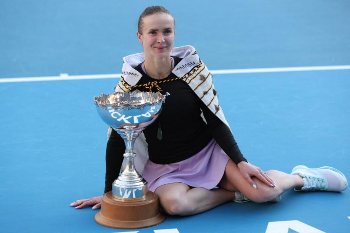Ukraine's Elina Svitolina celebrates with the trophy after her win against China's Wang Xinyu during the women's singles final at the WTA Auckland Classic tennis tournament in Auckland on January 11, 2026. Michael Bradley / AFP
