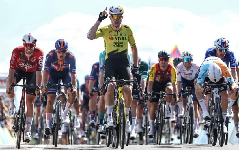 Team Visma | Lease a Bike's Belgian rider Wout Van Aert celebrates crossing the finish line to win the 5th stage of the Tour Auvergne-Rhone-Alpes cycling race (formerly known as the Criterium du Dauphine), 195,8km between Saint-Chamond and Villars-les-Dombes, central France, on June 11, 2026. Anne-Christine POUJOULAT / AFP