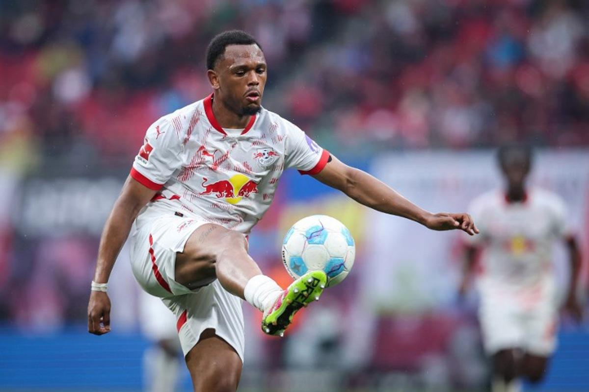 Leipzig's Belgian forward #11 Lois Openda plays the ball during the German first division Bundesliga football match between RB Leipzig and FC Bayern Munich in Leipzig, eastern Germany on May 3, 2025. Ronny Hartmann / AFP