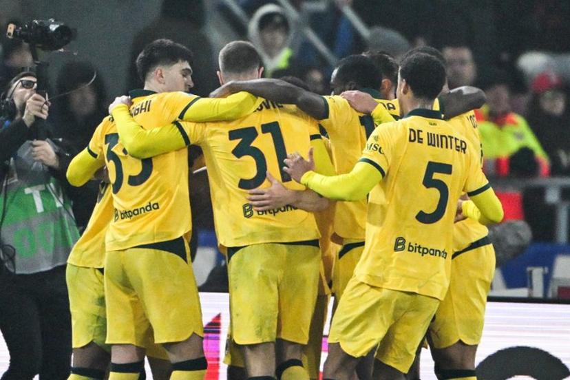 AC Milan's French forward #18 Christopher Nkunku (unseen) celebrates with teammates after scoring a penalty during the Italian Serie A football match between Bologna and AC Milan at the Renato Dall'Ara stadium in Bologna on February 3, 2026. Andreas SOLARO / AFP
